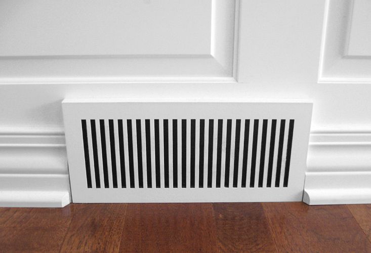 white wainscot with laminated geometric baseboard register